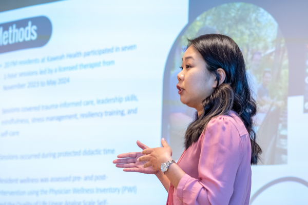 Resident doctor presenting research