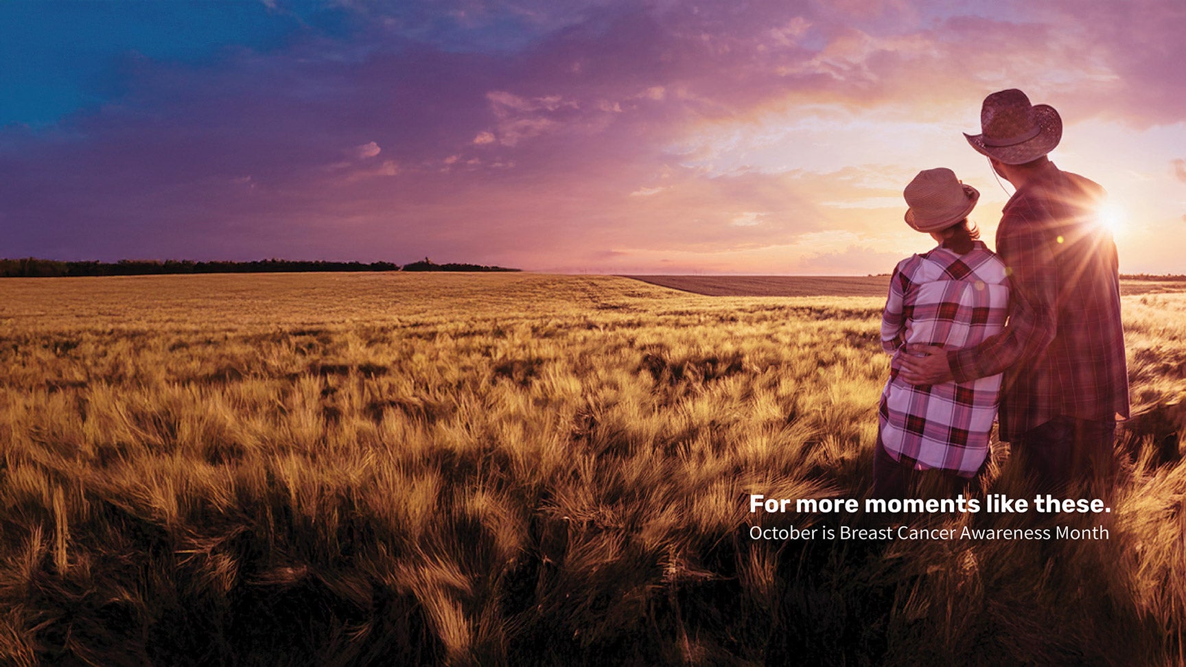 Farmer and wife standing in a field.