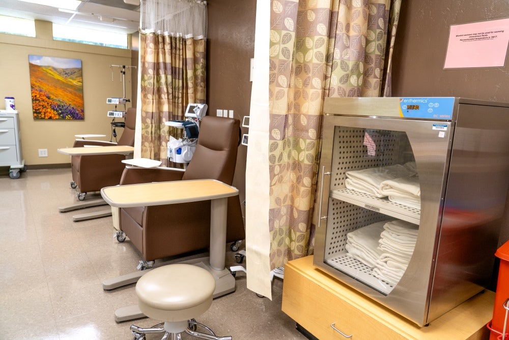 infusion chairs next to blanket warmer