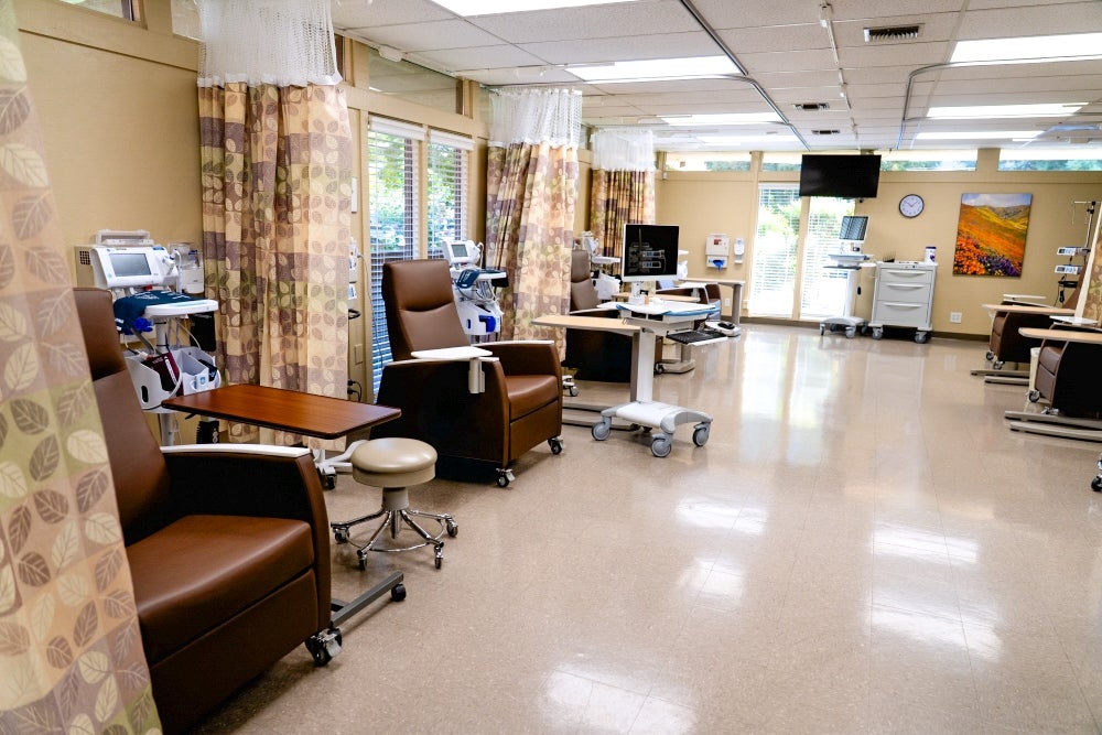 infusion center indoor with a row of 3 chairs set up for infusions