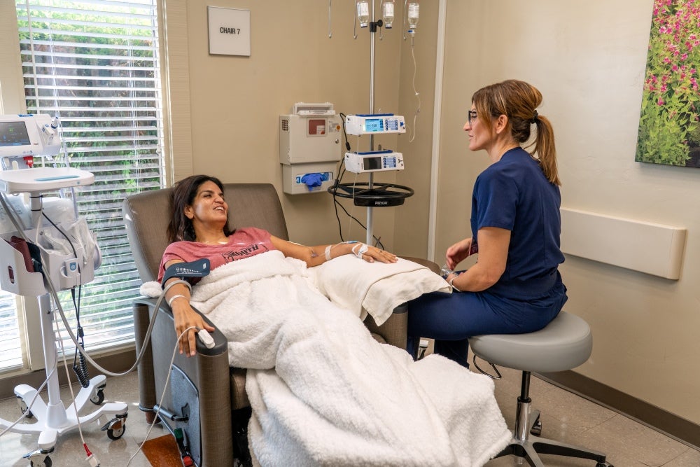nurse sitting by patient side