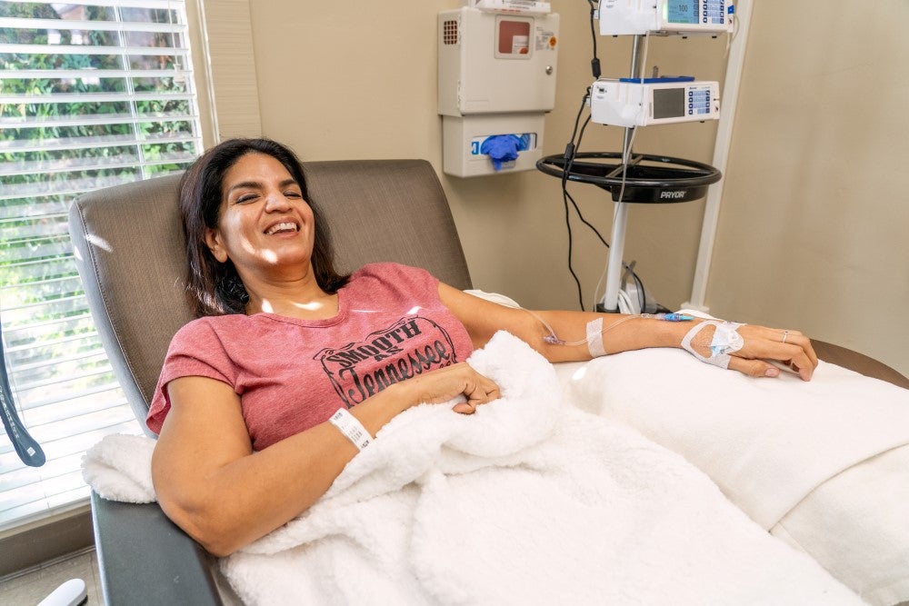 patient in chair with blanket