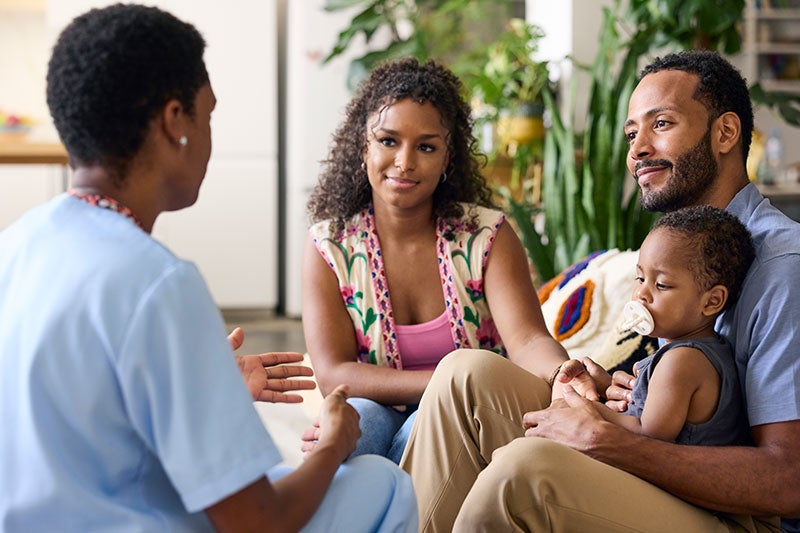 Family with young child at the doctor during flu season