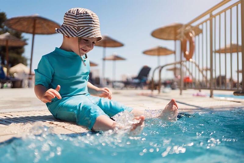 Child at the pool in the summertime