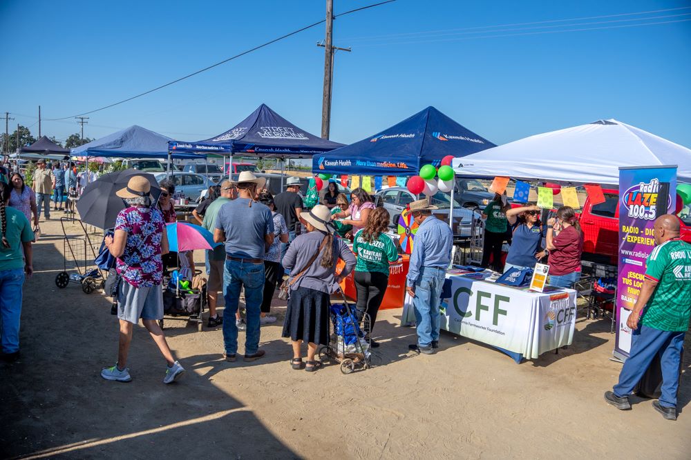 outreach team at a booth at the visalia swap meet