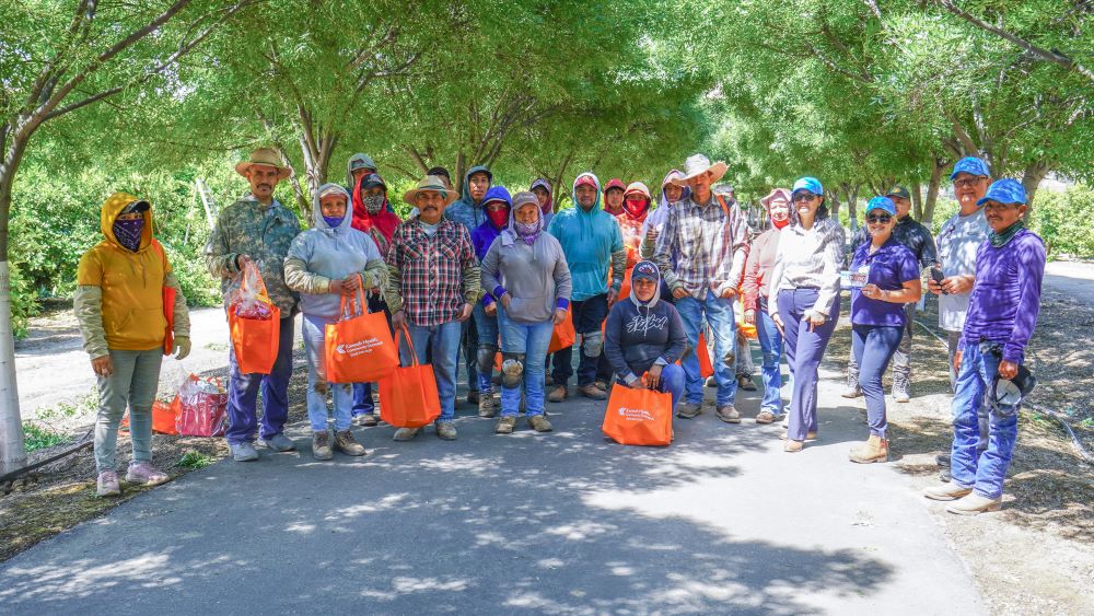 group photo of the outreach team and farm workers
