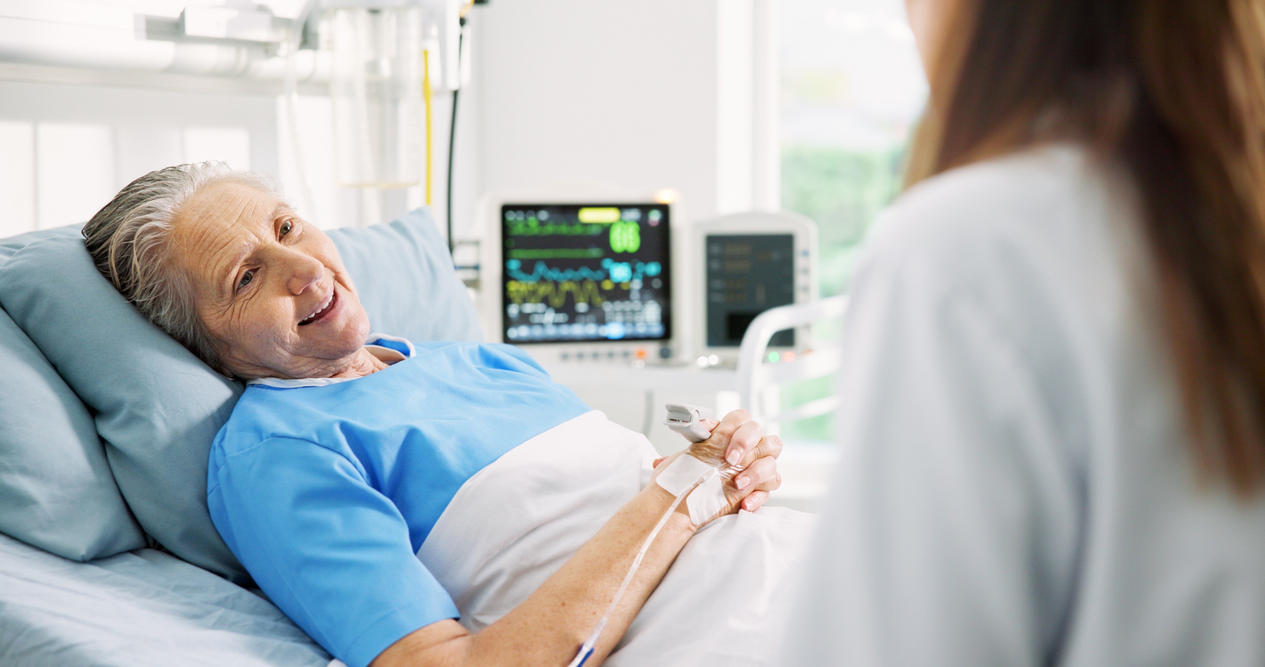 An unnamed patient smiled up at a nurse in this stock photo.