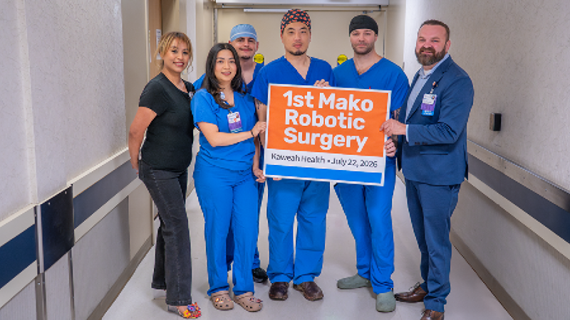 Dr. Jun Kim and his specialized surgical team celebrate the first Mako robotic surgery.