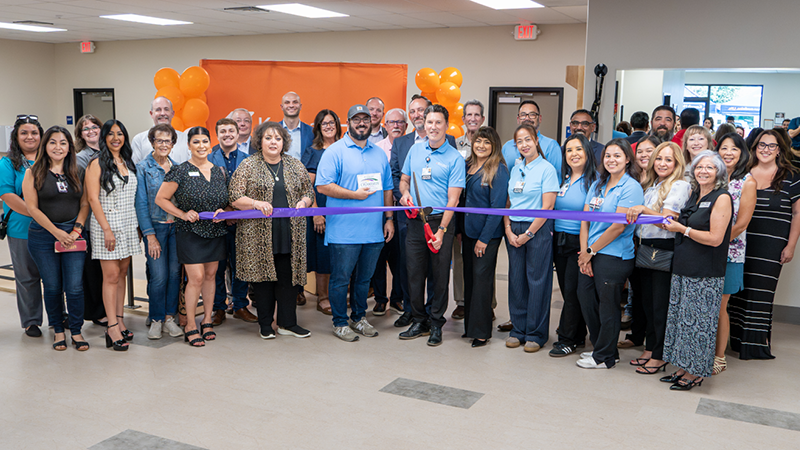 Kaweah Health board members, executive team members, and staff are joined by Tulare community members at a ribbon cutting for the facility.